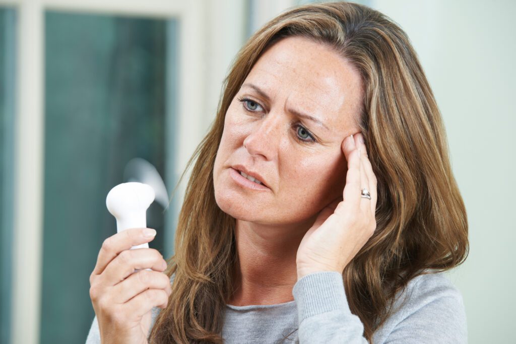 woman experiencing hot flash during menopause