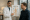 doctor holding a chart on hormones and metabolism while speaking with a male patient.