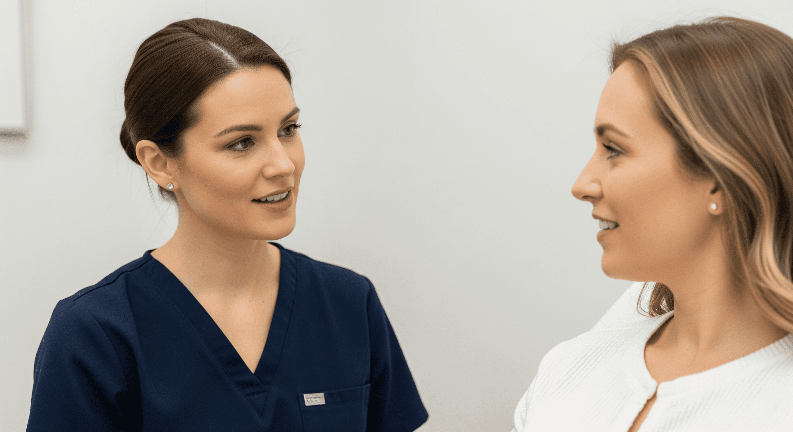 2026 01 mirabilemdcom img patient provider aesthetic discussion v1 mirabile md - aesthetic provider speaking with a patient about treatment options