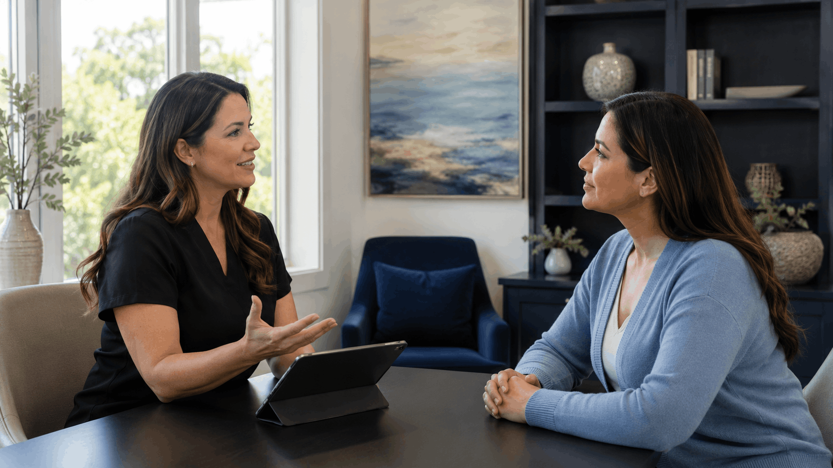 provider and patient discussing cosmetic treatment options during a private consultation.