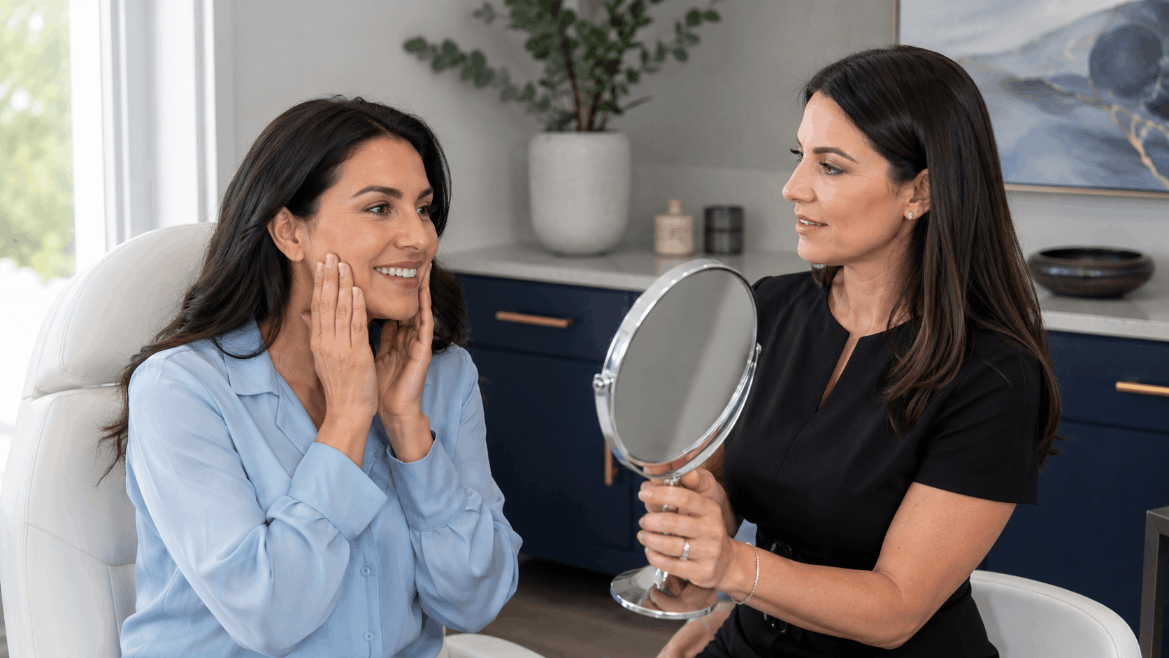 patient examining her face in a mirror with an aesthetic provider.