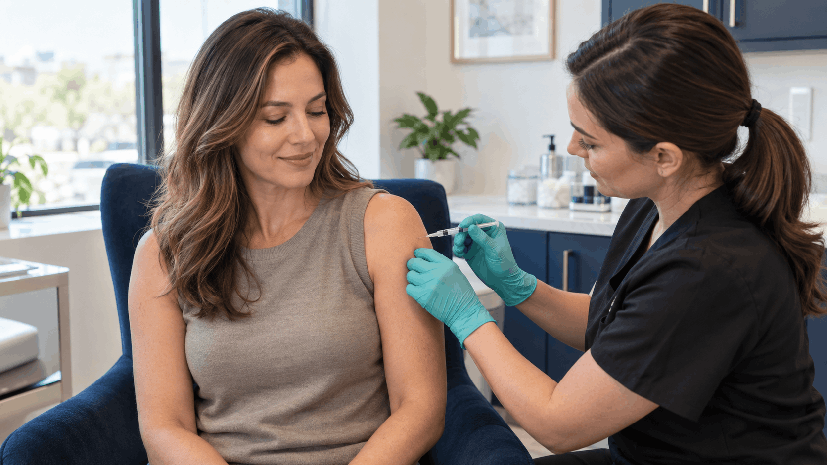 medical provider administering an injection into a woman's upper arm